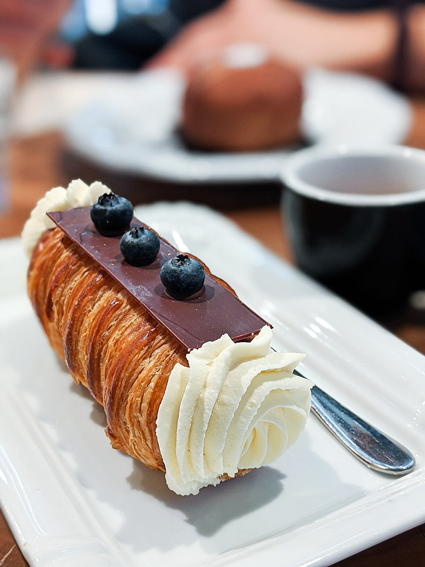 Chocolate Blueberry Cream Horn Pastry on White Plate