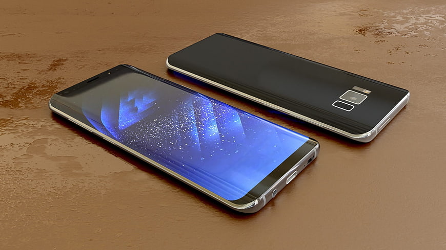 Two black smartphones on a textured brown surface