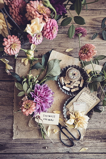 Vintage flat lay with dahlia flowers, old paper, and farewell summer tag