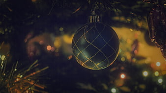 Close-up of Blue Christmas Bauble with Gold Lattice Pattern