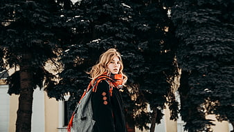 Blonde Woman in Orange Scarf Walking in Winter