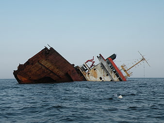 Rusty Sinking Ship Wreck in the Ocean