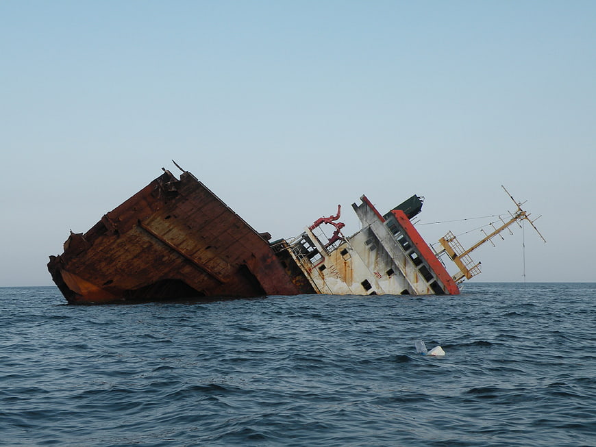 Rusty Sinking Ship Wreck in the Ocean