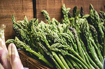 Fresh Green Asparagus Bunch on Wooden Background