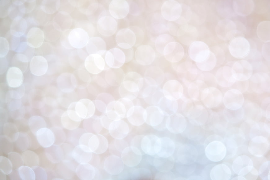 Soft White and Gold Bokeh Background with Sparkling Lights