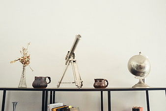 Vintage Telescope and Globe on Shelf with Copyspace