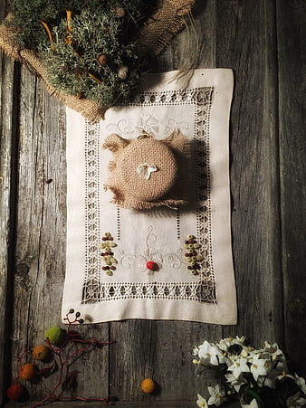 Vintage embroidered linen napkin on rustic wooden table