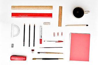 Flat Lay of Red Office Supplies and Stationery on White Background