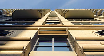Symmetrical Low Angle View of Modern Beige Architecture