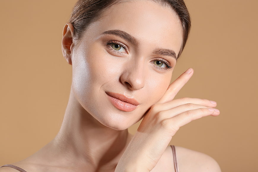 Close-up portrait of beautiful woman with fresh skin