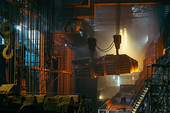 Heavy industrial crane lifting metal in steel factory