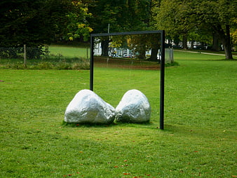 Silver rocks and mirror sculpture in green park