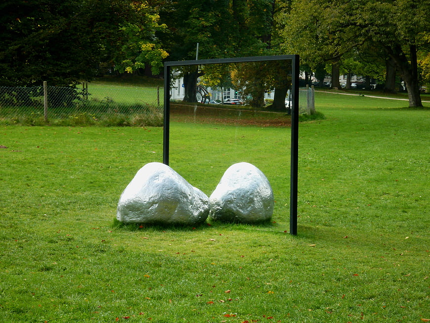 Silver rocks and mirror sculpture in green park