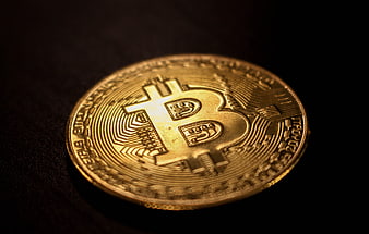 Physical Gold Bitcoin Coin On Dark Background
