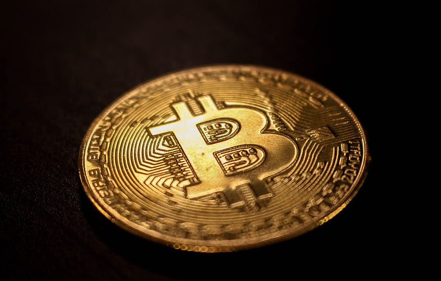 Physical Gold Bitcoin Coin On Dark Background