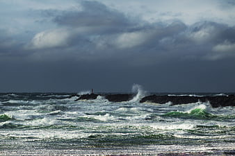 Stormy Ocean Waves Crashing Against Rocky Coastline