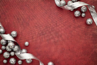 Silver Christmas Ornaments and Ribbon on Red Background