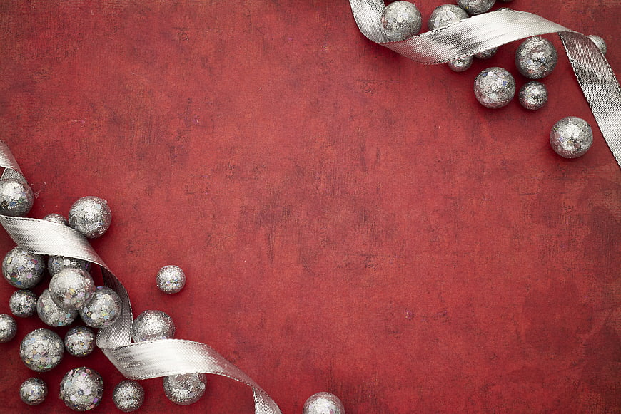Silver Christmas Ornaments and Ribbon on Red Background