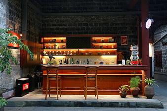 Rustic Wooden Bar Counter In Historic Stone Courtyard