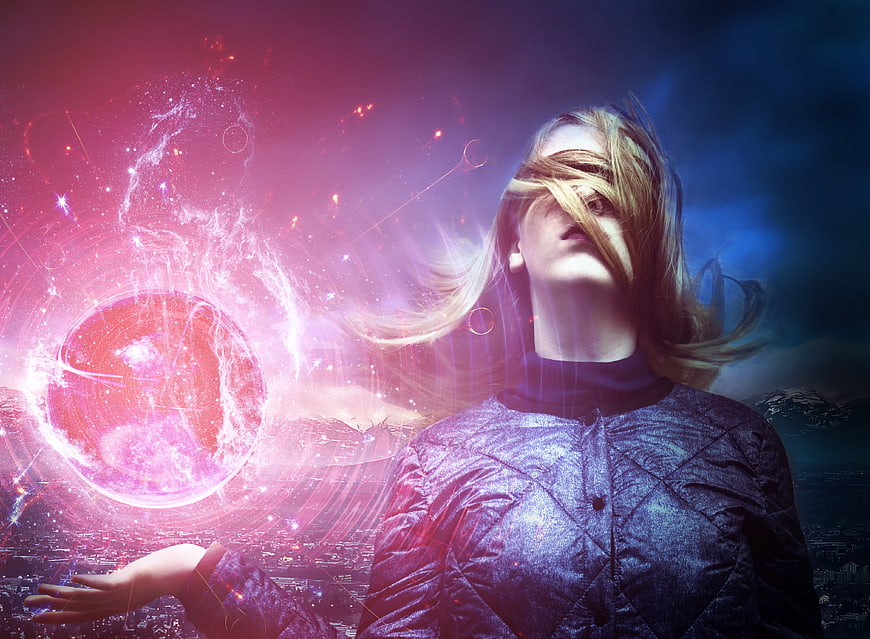 Blindfolded woman reaching toward cosmic energy portal