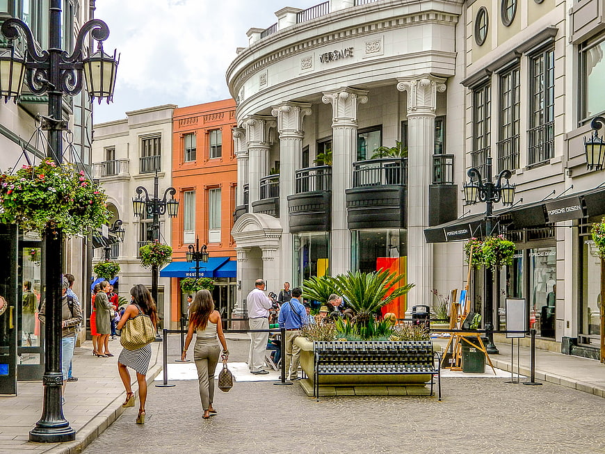 Luxury Shopping Street with Versace Store and Pedestrians
