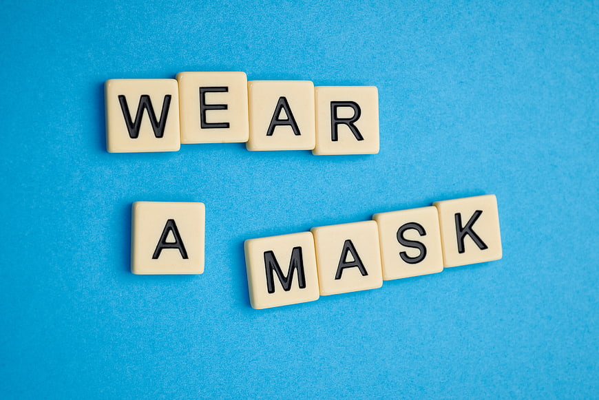 Wear A Mask Text on Blue Background