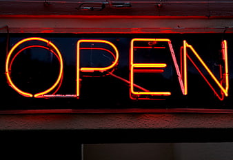 Red Neon Open Sign Glowing at Night