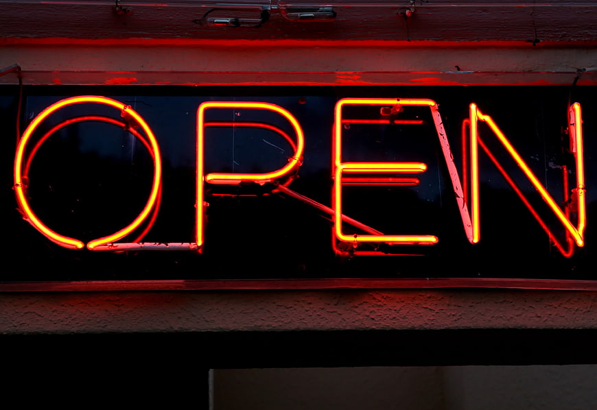 Red Neon Open Sign Glowing at Night