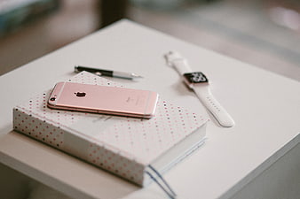 Rose Gold iPhone and Smartwatch on Polka Dot Notebook