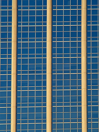 Abstract Blue Glass Building Facade with Vertical Columns
