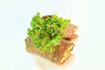 Healthy Whole Wheat Wrap with Fresh Lettuce on White Background