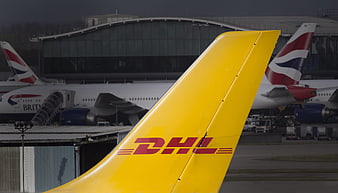 DHL Cargo Airplane Tail at Airport Terminal