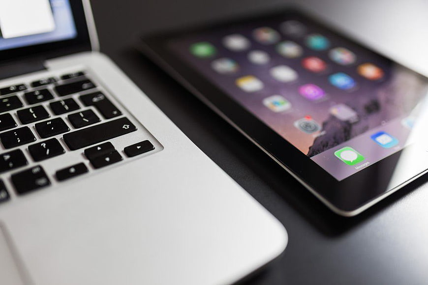 Close-up of MacBook and iPad on a desk