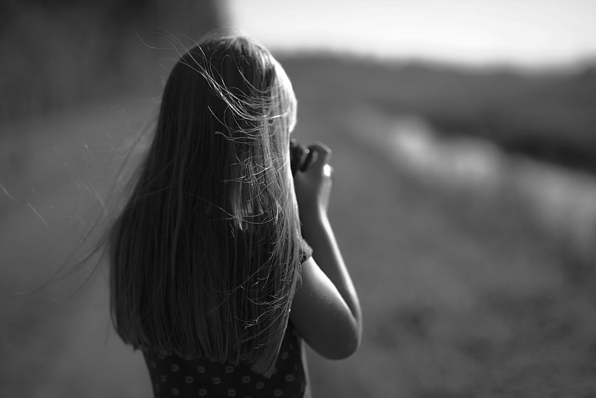 Girl Taking Photo in Black and White