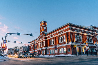 Red brick theater building with clock tower in winter city