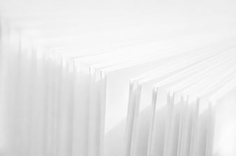 Close-up of white book pages with soft shadows