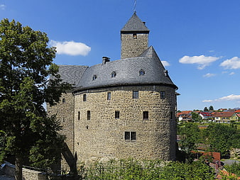 Historic stone castle tower on a sunny day