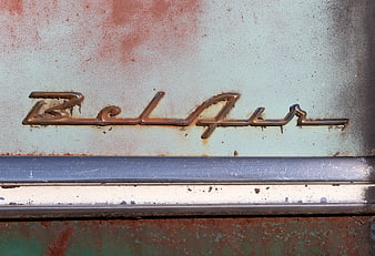 Rusty Bel Air Emblem on Vintage Car Body