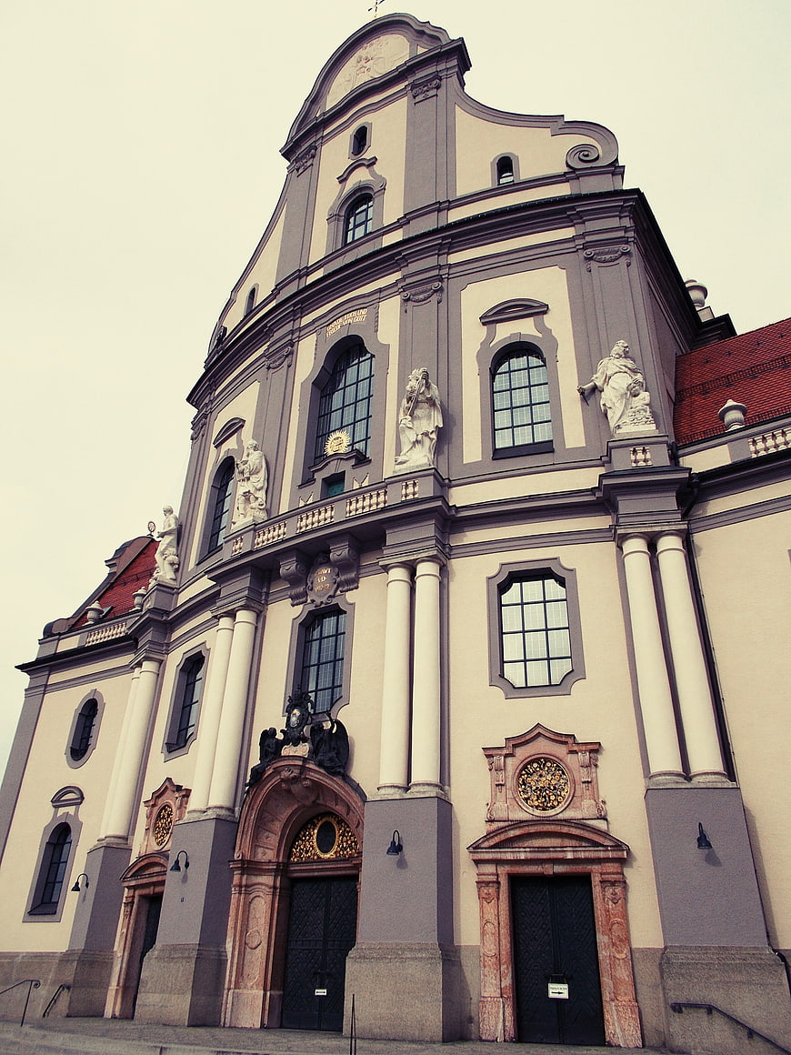 Low angle view of a baroque church facade with statues