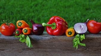 Fresh Vegetables Arrangement On Wooden Surface With Green Background