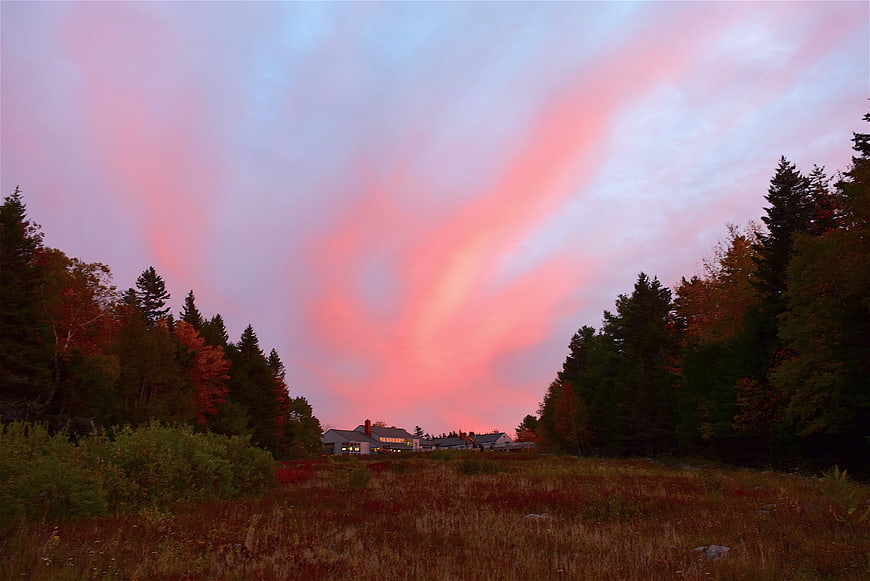 Dramatic Pink Sunset Sky Over Autumn Forest and House