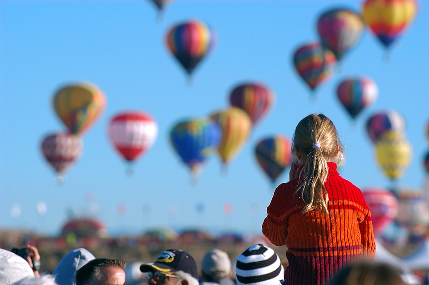 Child Watching Hot Air Balloons At Festival