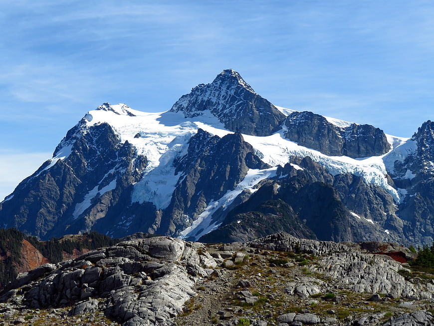 Majestic Snow-Capped Mountain Peak with Rocky Foreground