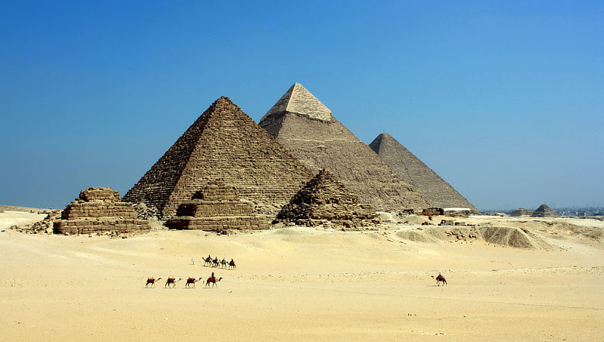 Pyramids of Giza with Camels in the Desert