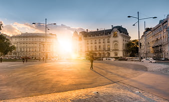 Golden hour sunset over Vienna city square with architecture
