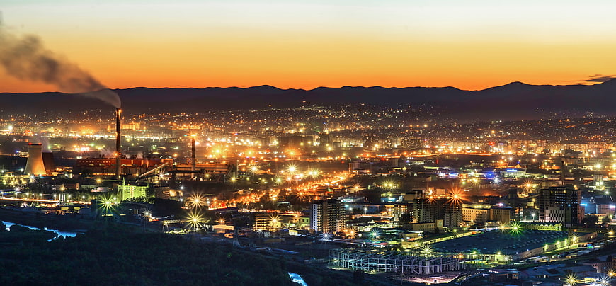Ulaanbaatar Cityscape at Dusk with Industrial Power Plant and Mountains