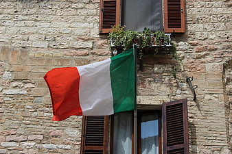 Italian Flag Waving on Historic Stone Building