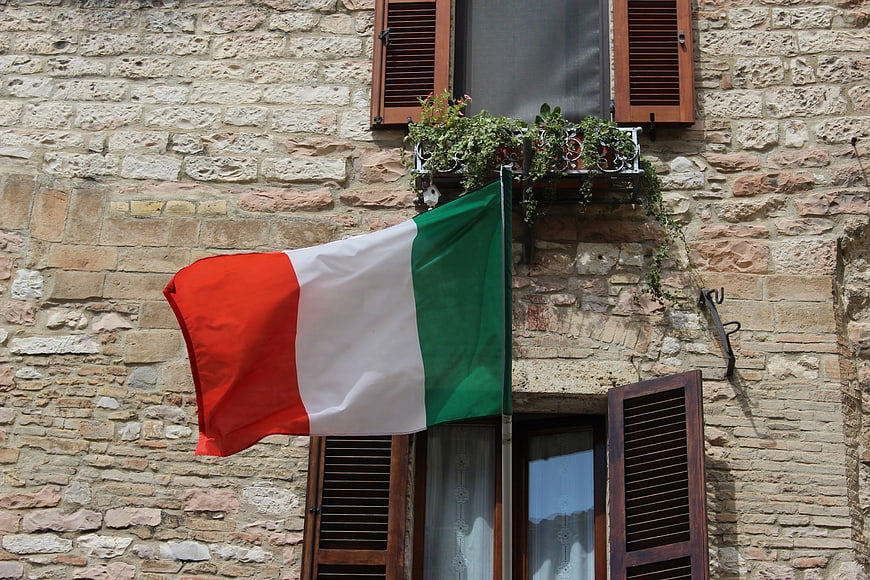 Italian Flag Waving on Historic Stone Building
