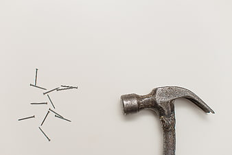 Vintage Hammer and Nails on White Background
