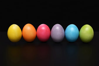 Colorful Easter Eggs in a Row on Black Background